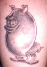 Cartoon teeth creature tattoo photo